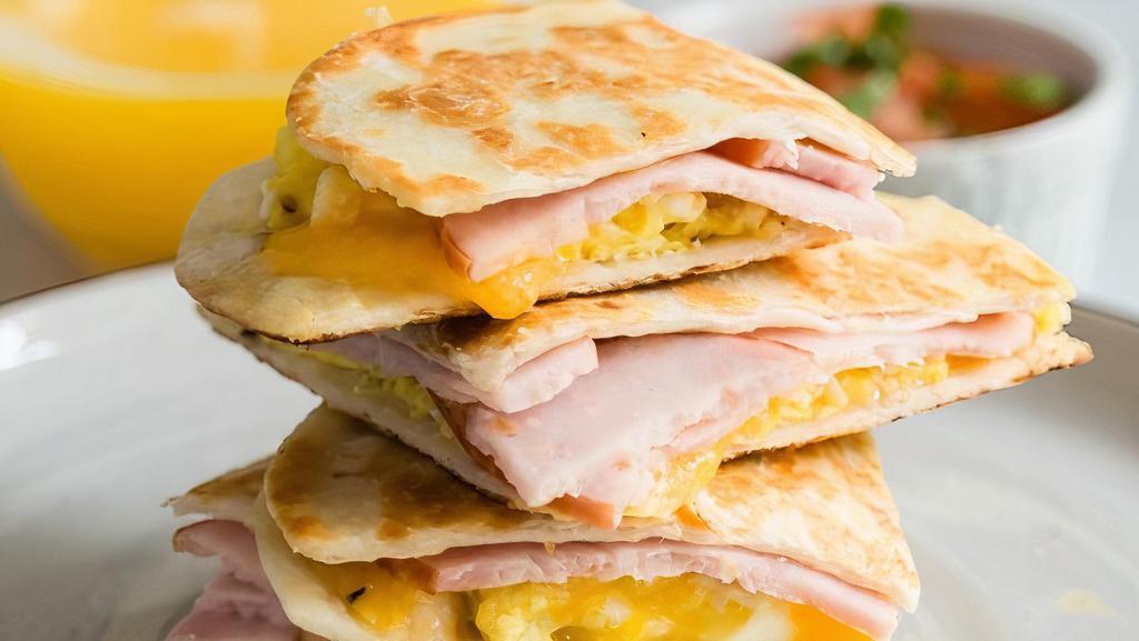 Breakfast Quesadilla · Eggs, one meat, ham, sausage, bacon, and turkey with Cheddar cheese.