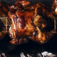 Especial Familiar De Pollo A La Braza · 2 whole charbroiled chickens with choice of 5 sides and 4 soda cans.