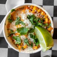 Street Corn · Our take on the classic Mexican street corn. Topped with cotija cheese, our house made esqui...
