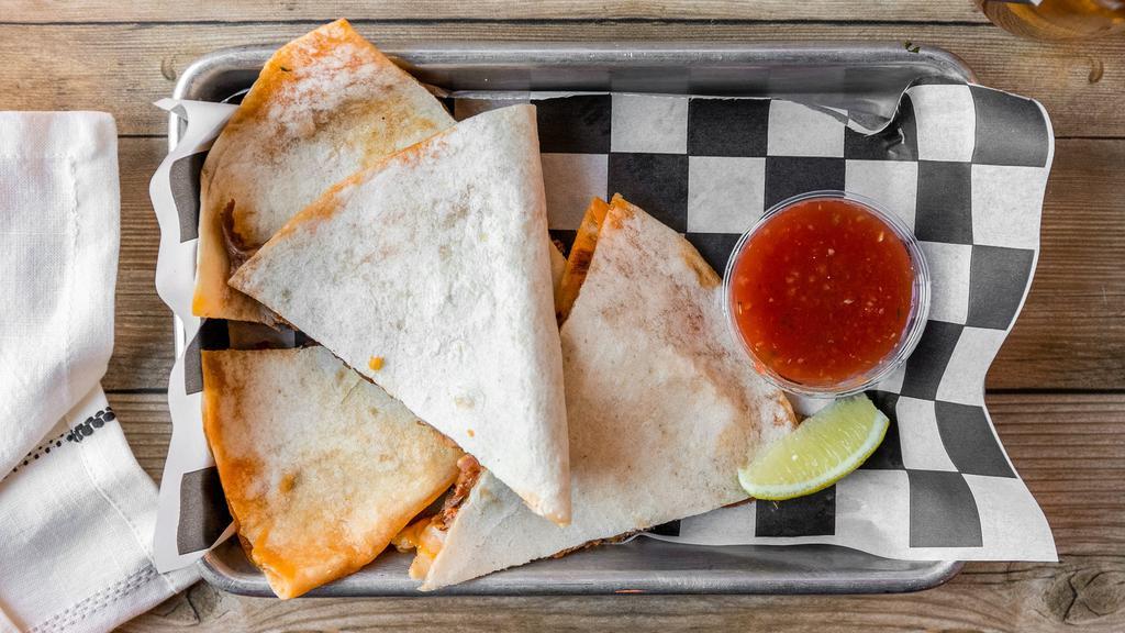 Adult Quesadilla · Features a large taco loco tortilla folded with a healthy serving of melted Mexican cheese blend, a sprinkling of cotija cheese, diced white onion, pickled jalapeños, house made esquites sauce, and choice of meat and salsa.
