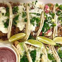 Party Pack (9 Tacos) · Get a pack of 9 street tacos served with a side of  chips and your choice of salsa. Our best...