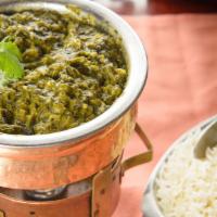 Saag Paneer · A flavorful blend of fresh spinach, ginger, onions and cubes of homemade cottage cheese, coo...