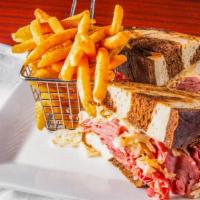 Deli Style Reuben · Hand-carved corned beef piled high on thick cut marble rye, sauerkraut, Swiss cheese and tho...