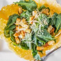 Not Your Average Caesar · Homemade edible bowl made with Parmigiano- Reggiano cheese, filled with fresh crisp baby rom...