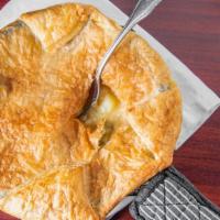 Chicken Pot Pie (Individual Size) · Tender braised chicken with carrots, celery, onions and please in a savory gravy, topped wit...