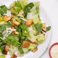 Caesar Salad · Romaine lettuce, hard boiled eggs, croutons, parmigiana cheese.