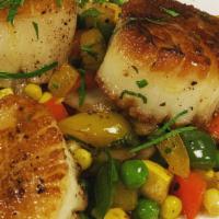 Seared Scallops · Three pan roasted scallops served with a seasonal succotash and a citrus sauce.