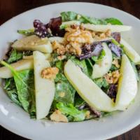 Fuji Apple Walnut Salad · Baby Greens, apple, walnut, and blue cheese dressing.