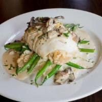 Crab Stuffed Filet Of Sole In A Mixed Mushroom Sauce · Served with roasted garlic mashed potatoes and hericot verts.