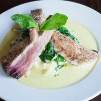 Pan Seared Rare Tuna · Served with roasted garlic mashed potatoes, spinach, and banana coconut curry sauce.