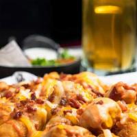 Blt Tots! · Tater tots baked with bacon & cheese.   Topped with shredded lettuce & diced tomatoes with a...