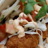 Grilled Chicken Soft Tacos · 2 Soft Tacos filled with Grilled Chicken, slaw, & Yum Yum sauce on a soft sandwich roll with...