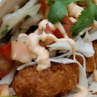 Crispy Chicken Soft Tacos · 2 Soft Tacos filled with Crispy Chicken, slaw, & Yum Yum sauce on a soft sandwich roll with ...