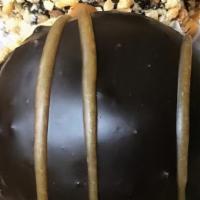Peanut Butter Explosion · A chocolate candy bar bottom. Topped with peanut butter ganache and a mound of chocolate mou...