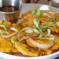 Tostones · Gluten-free. Vegan. Grilled onions and mojo Verde.