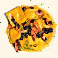 Butternut Squash Ravioli · Tossed with baby carrots, sun dried cranberries, sage and mango butter.