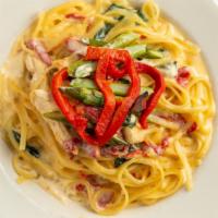 Chicken Gondola · Chicken, asparagus, roasted red peppers, baby spinach served over linguine in gorgonzola cre...