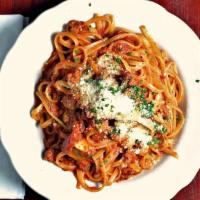 Veal Bolognese · In a classic tomato sauce with pancetta and mushrooms over spaghetti.