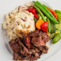 Tuscan Tips · Marinated steak tips in our own blend of bourbon sauce.