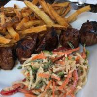 Texas Tips · Marinated and grilled.  Hand cut fries, classic cole slaw. Gluten free.