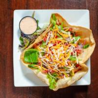 Taco Salad · Spring Mix, Diced Grilled Chicken, Pico De Gallo, Blended Cheese tossed in our Station Tap D...