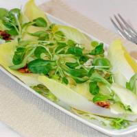 Salade D'Endive Au Roquefort · Endive and mache salad with apple, walnut and roquefort.