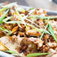 Crispy Potato Skins · beer cheese, bacon crumble, spicy ranch, green onion