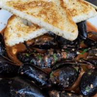 Diablo Mussels · tomatoes, onions, chiles, andouille sausage served with sourdough.