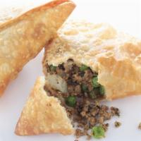 Lamb Samosa (2 Pieces) · Handmade pastry filled with sautéed seasoned minced lamb. Served with green and red chutneys.