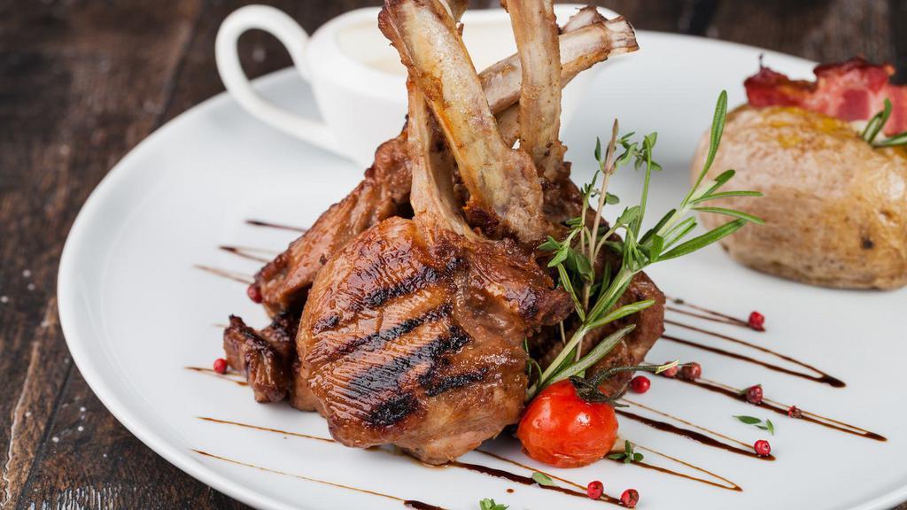 Lamb Chops (4 Pieces) · Marinated and cooked in spicy in house blend. Served with chutney and house salad.