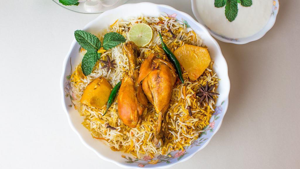 Chicken Biryani · Seasoned chicken pieces cooked in a traditional oven, sautéed in spices, layered in long grain basmati rice.