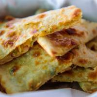 Onion Stuffed Naan · Traditional Indian Flatbread stuffed with finely chopped seasoned red onion.