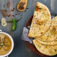 Chili Naan · Indian flatbread made from white mix flour, cooked in a traditional tandoor oven and topped ...