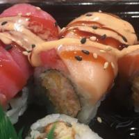 Hawaii Roll · Spicy crab topped with tuna and salmon with spicy mayo and eel sauce.
