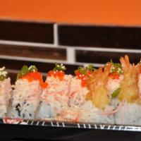 Sp12. Snow Mountain Maki · Eight pieces shrimp tempura maki, topped with special crab meat salad and tobiko with yuzu m...