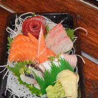Sashimi Plate · Fifteen pieces chef's choice of sashimis served with sushi rice.