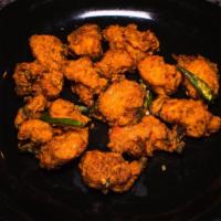 Chicken Pakora · Tender chicken pieces dipped in mildly spiced chickpea batter and fried to a crisp.