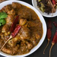 Gongura Chicken · Boneless chicken cooked with tangy gongura(red sorrel)
leaves, onions and exotic spices