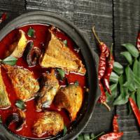 Andhra Fish Curry · Tilapia fish cooked with onions, tomato puree, curry leaves and spices.