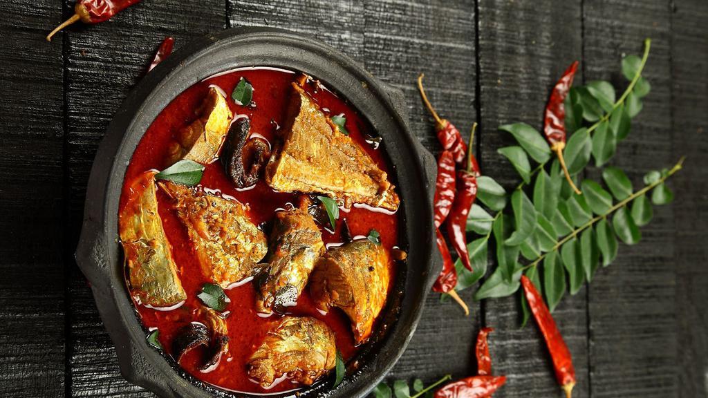 Andhra Fish Curry · Tilapia fish cooked with onions, tomato puree, curry leaves and spices.