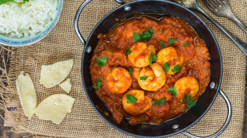 Shrimp Masala · Marinated shrimp cooked in tomatoes and onions with mild creamy sauce.