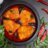 Fish Masala · Salmon cooked in a hearty blend of onions, tangy tomatoes, coconut and fenugreek seeds.