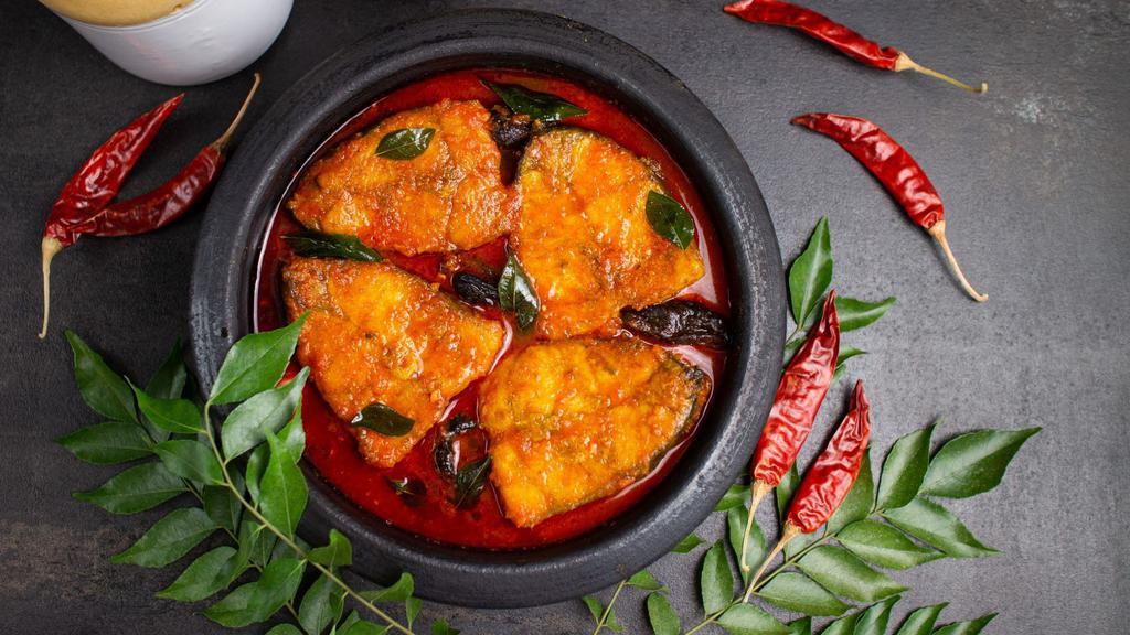 Fish Masala · Salmon cooked in a hearty blend of onions, tangy tomatoes, coconut and fenugreek seeds.