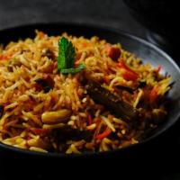 Vegetable Biryani · Layers of fluffy saffron flavored basmati rice cooked with mixed vegetables in aromatic spic...