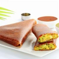 Mysore Masala Dosa · Thin rice and lentil crêpe filled with deliciously spiced onions and potatoes and a layer of...