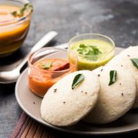 Idli · Steam cooked rice and lentil cakes.