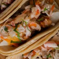 Baja Taco** · Soft corn tortillas with choice of lightly breaded shrimp or fish, pickled cabbage, pico de ...