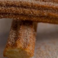 Churro** · Warm Mexican doughnut stick dusted in cinnamon sugar.