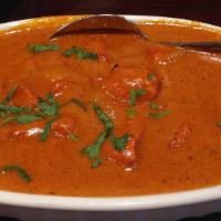 Chicken Tikka Masala · Chicken breast cooked in onions and bell peppers in tomato sauce with exotic herbs, and crea...