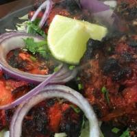 Tandoori Chicken (5 Pcs) · On sizzler. One half chicken marinated overnight in yogurt and spices and barbecued in a tra...
